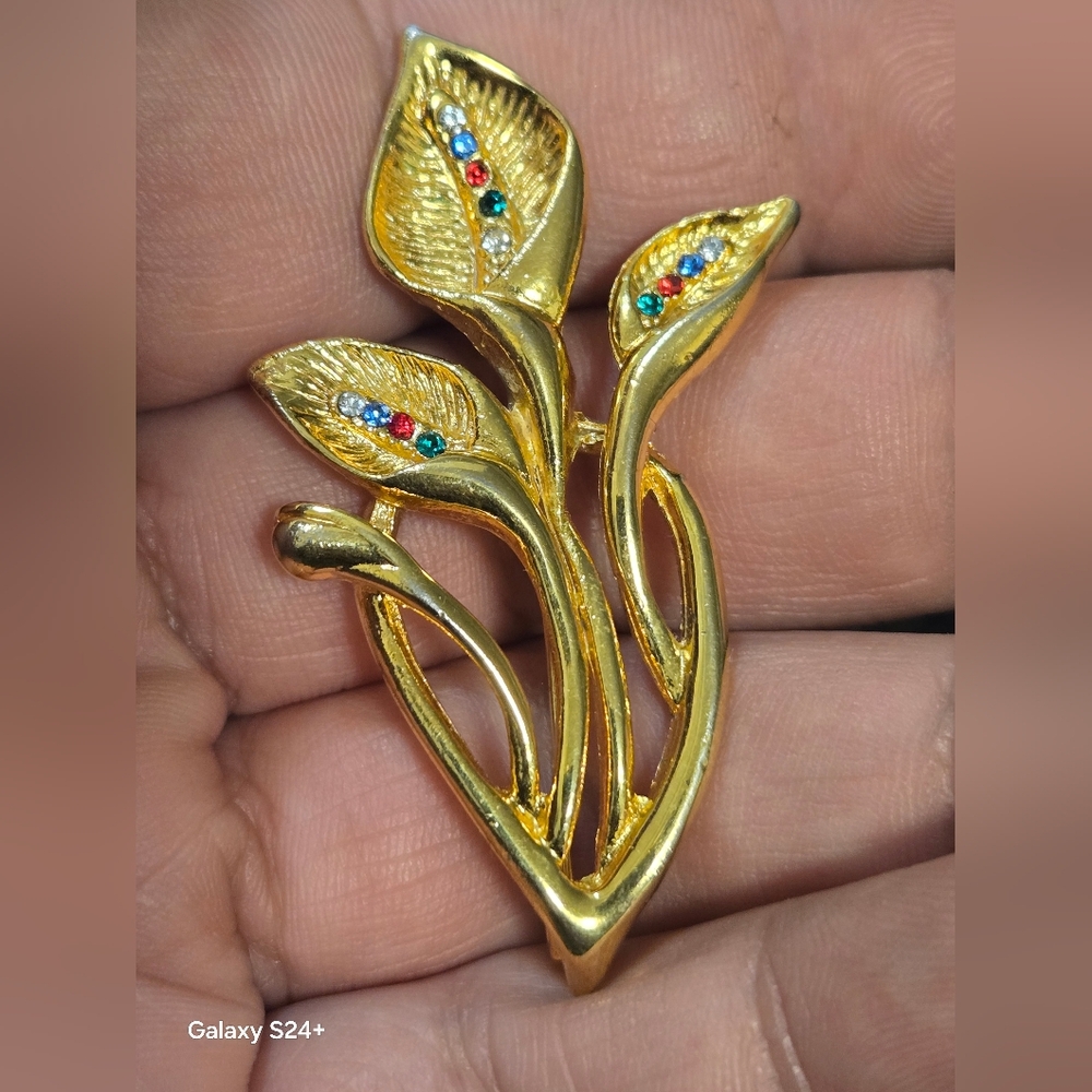 Elegant Gold Leaf Brooch with Gem Accents